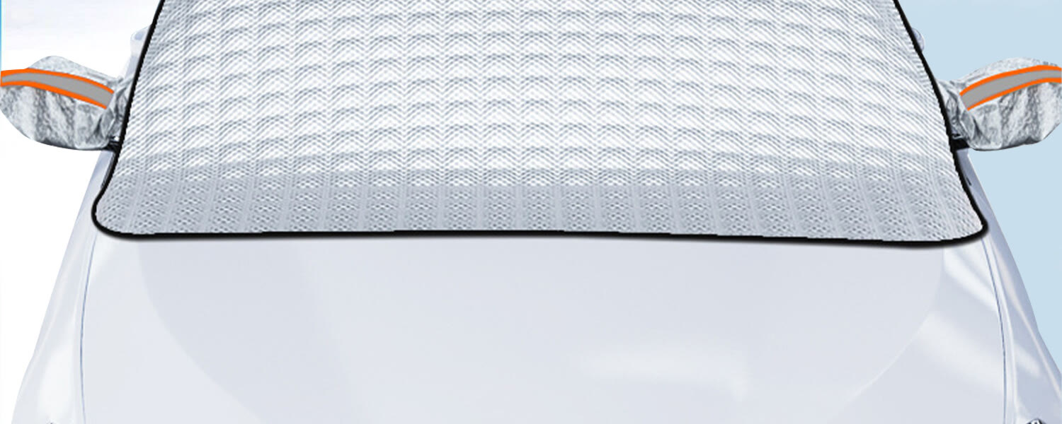 Front of a silver car with the cover over the windshield and sleeves over both side mirrors